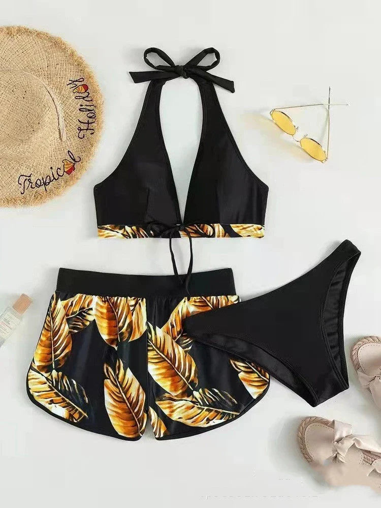 A stylish 3-piece leaf print bikini set with matching shorts, available in a variety of vibrant colors and patterns