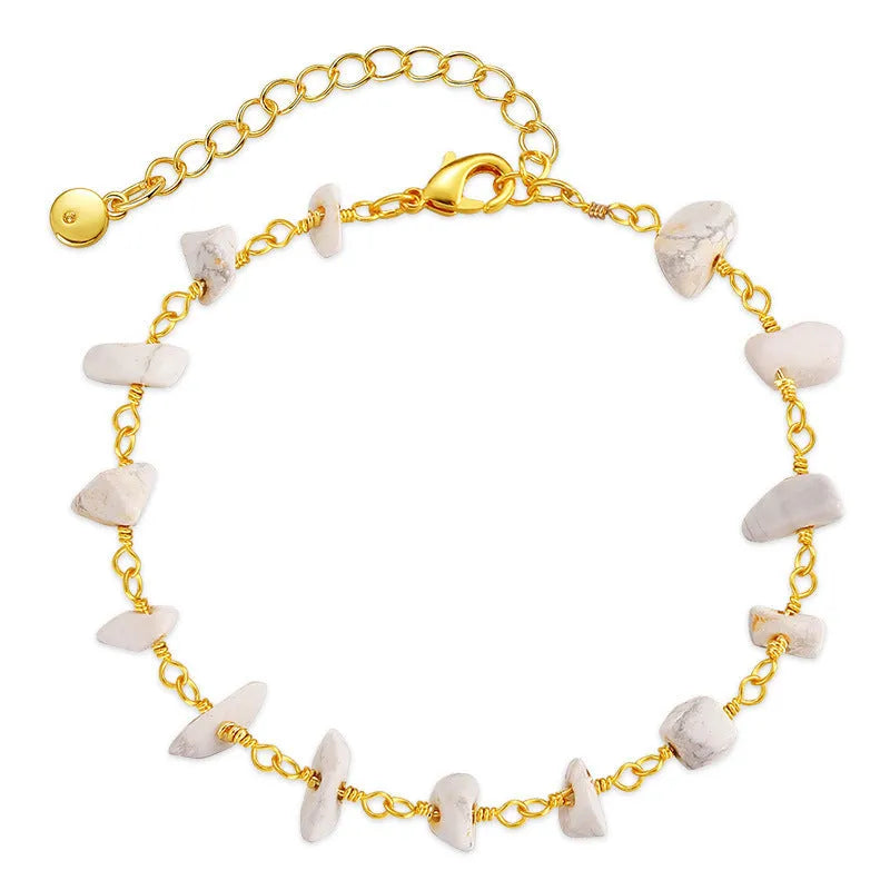 Geometric women's bracelet with irregular turquoise stones in 18K copper on a white background.