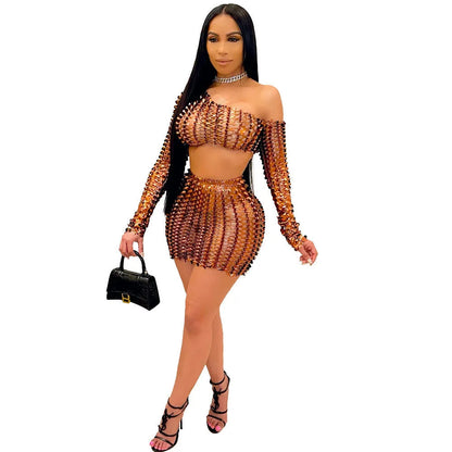 Women's black hollow-out two-piece set with sleeveless top and short skirt on a model.