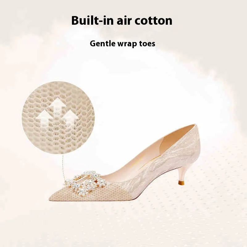 Champagne gold pointed-toe high heel pumps with stiletto heel and rhinestone decoration on the upper.