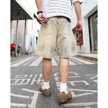 Men's light blue denim shorts with distressed finish and straight-leg silhouette