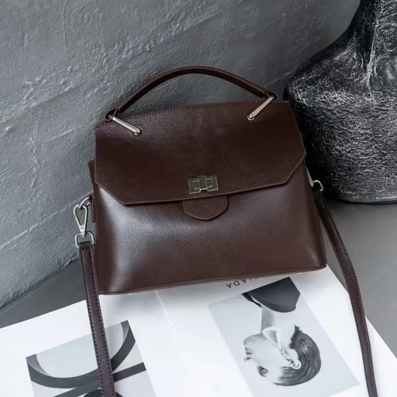 Genuine vegetable-tanned leather messenger bag in urban simplicity style with internal organisation pockets