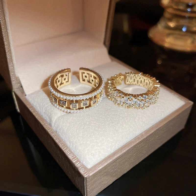 Elegant square ring with hollowed-out design and shimmering zircon stones, perfect for the stylish British woman