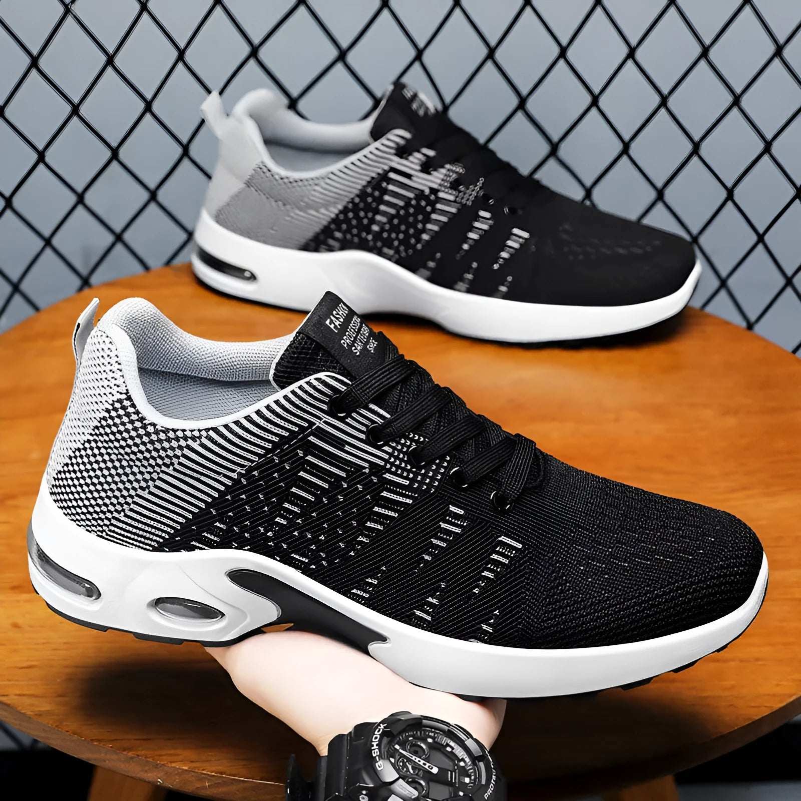 Men's black Flyknit mesh sneakers with round toe and lace-up front in casual low-top design