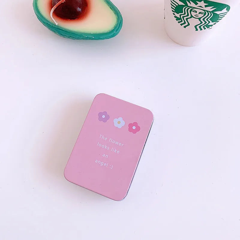 Small white iron storage box with a printed apple girl design on the lid.
