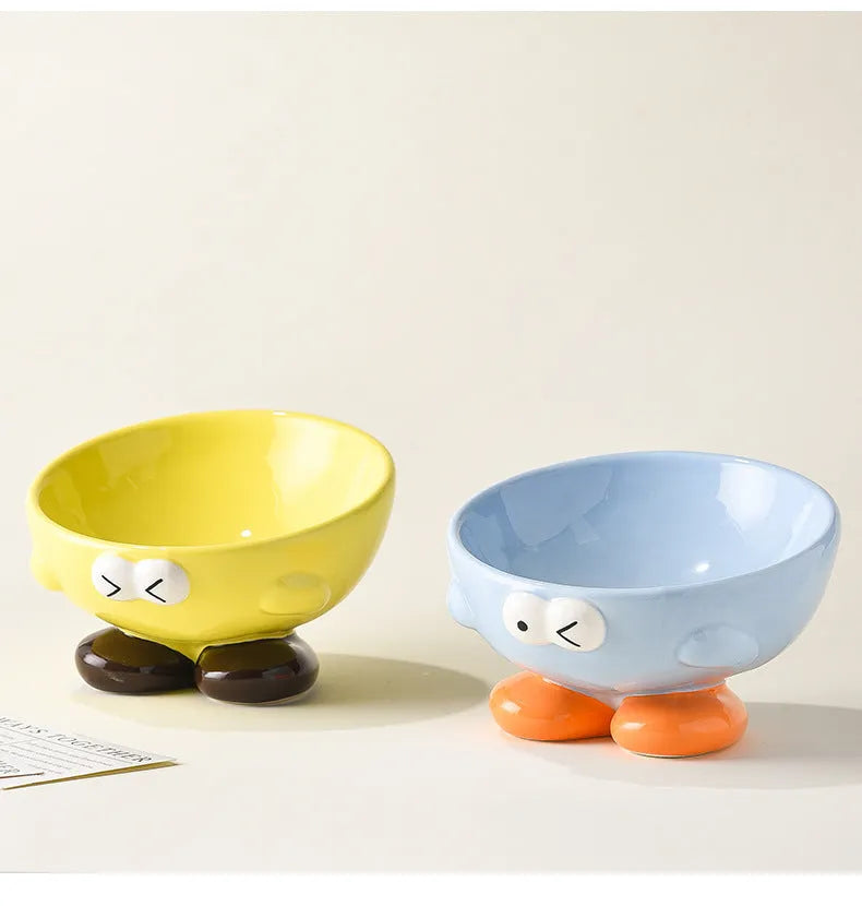 Ceramic slanted pet bowl with decorative expression pattern in blue colour