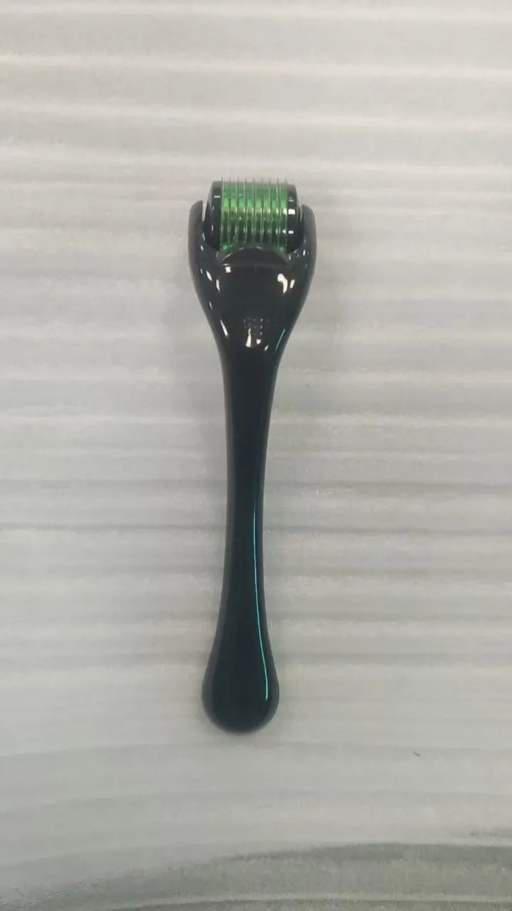 Sterile micro needle derma roller with black handle and coloured wheel on white background