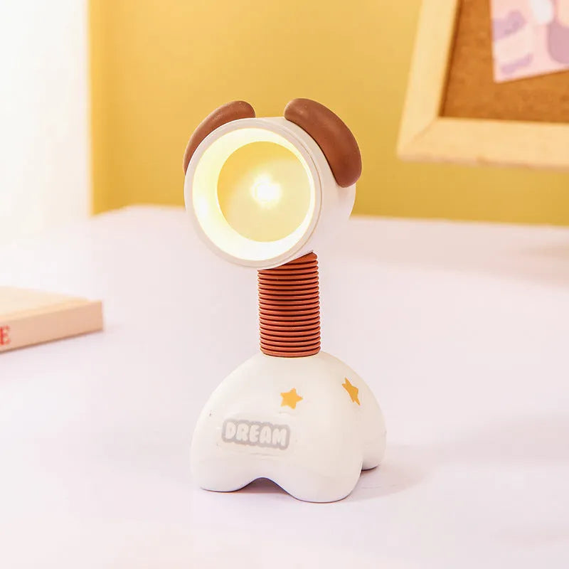 Colourful cartoon character magnetic DIY night light on a desk with adjustable head.