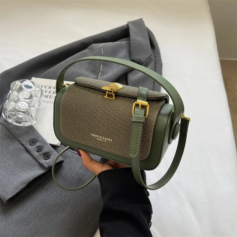 Women's PU leather messenger bag in a horizontal square shape with a lock and adjustable shoulder strap.