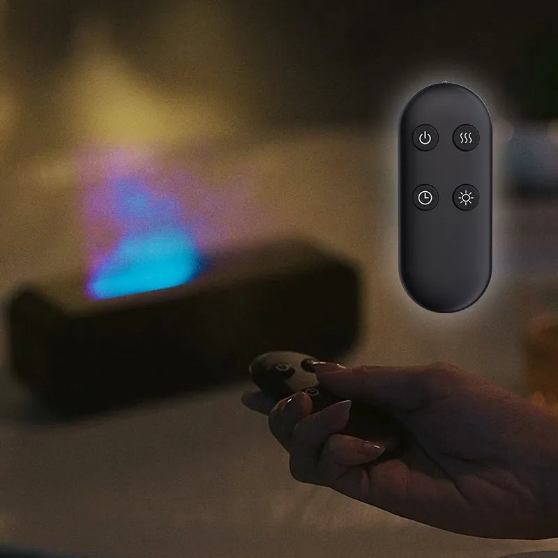 Black and white USB aroma diffuser with remote control showing flame dynamic and colour-changing light effects.