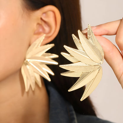 Gold and white alloy leaf-shaped patch earrings with botanical design