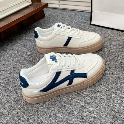 Low-top blue and brown casual lace-up shoes with round toe and flat rubber sole.