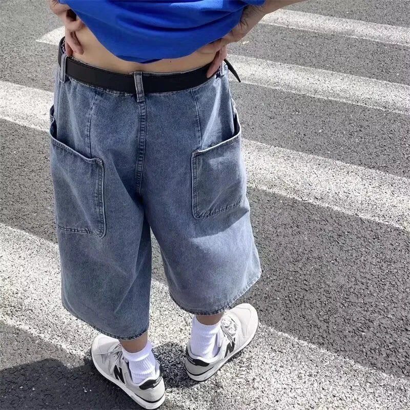 Men's blue washed denim shorts with high waist and cropped straight-leg design on a neutral background