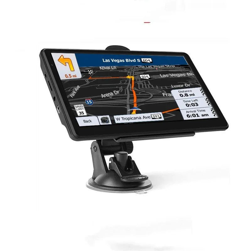 Black portable 7 inch car GPS navigation device with bracket and car charger on a dashboard.
