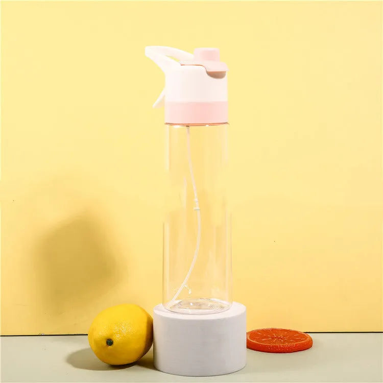 White spray water bottle with black leakproof lid and handle strap on a table