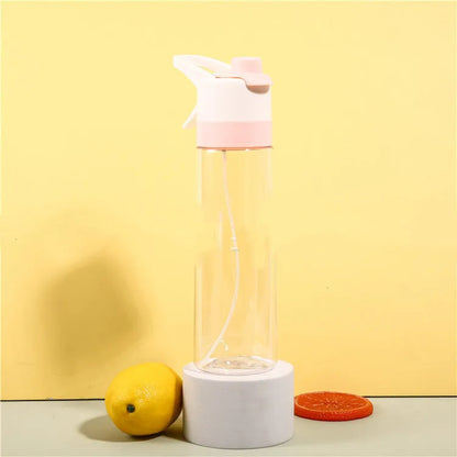 White spray water bottle with black leakproof lid and handle strap on a table