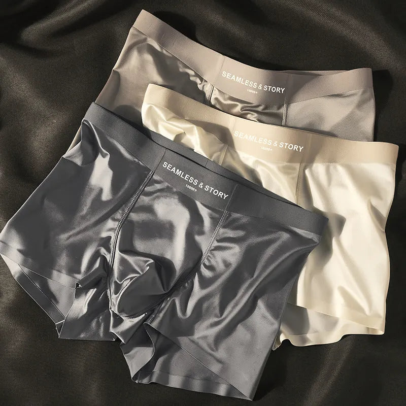 Men's solid colour satin ice silk boxer shorts laid flat, showing mid-waist design.