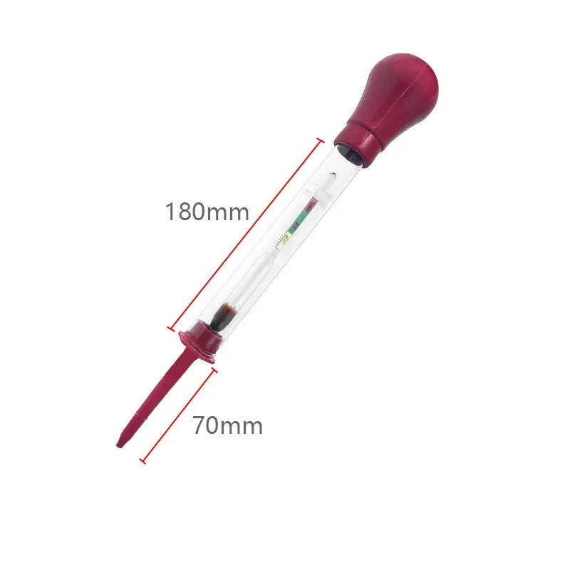 A red and black glass electrohydraulic hydrometer for testing car battery electrolyte density.