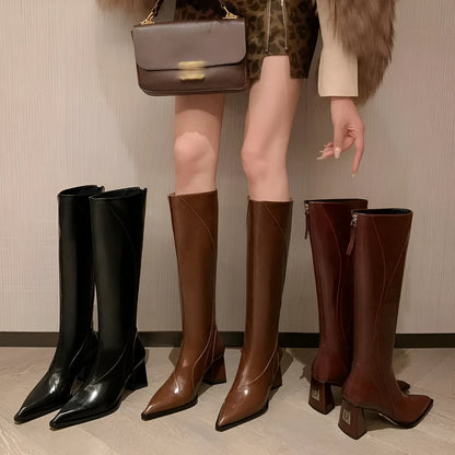 Women's black retro high heel riding boots with a waterproof platform and cowhide upper.