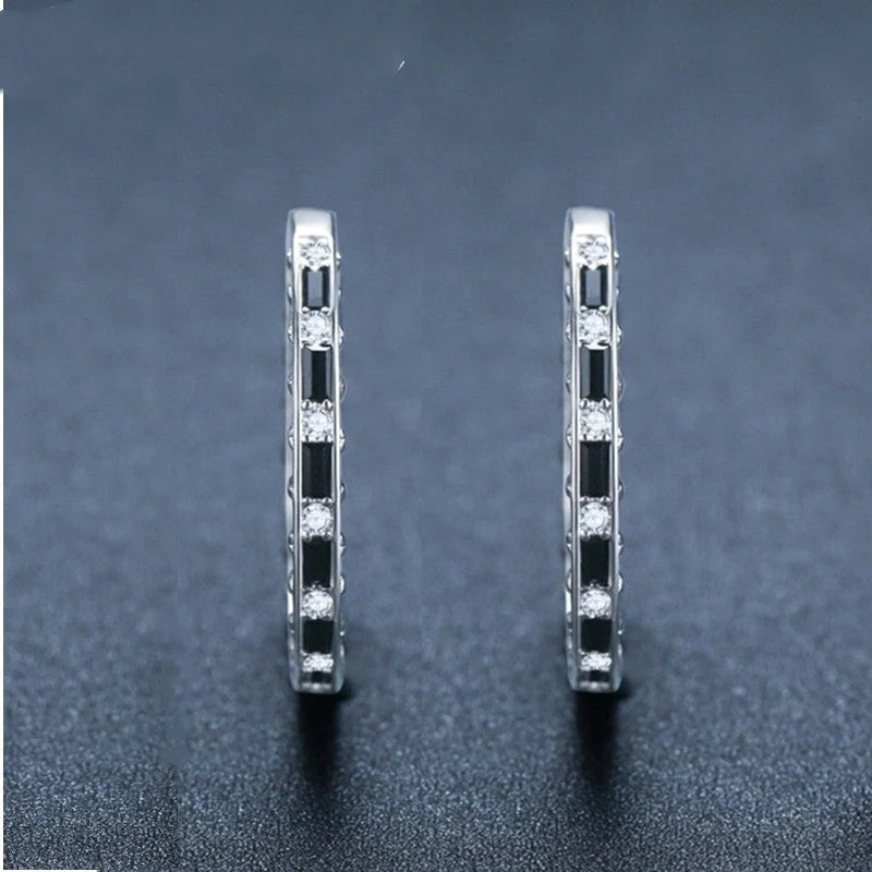 Elegant black zircon earrings featuring a geometric design, crafted from premium copper for a lustrous finish