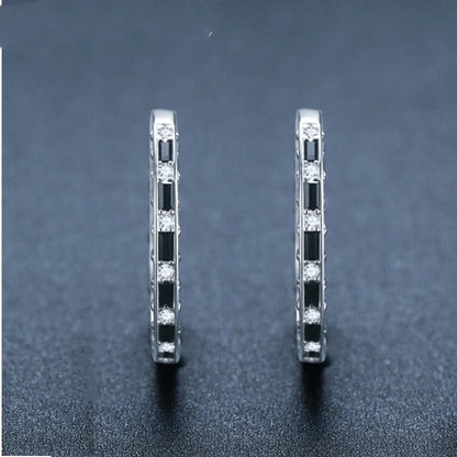Elegant black zircon earrings featuring a geometric design, crafted from premium copper for a lustrous finish