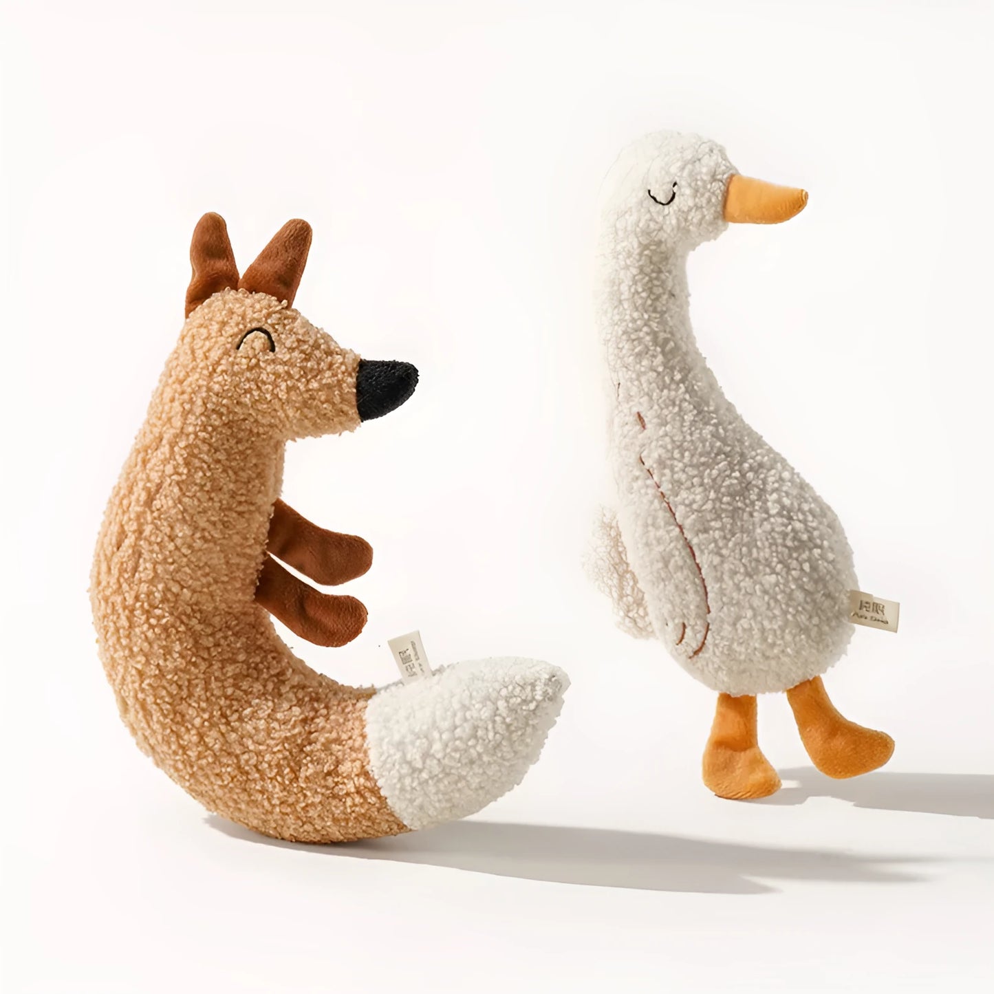 Cartoon fox and duckling pet chew toys made from teddy velvet fabric with sound paper components