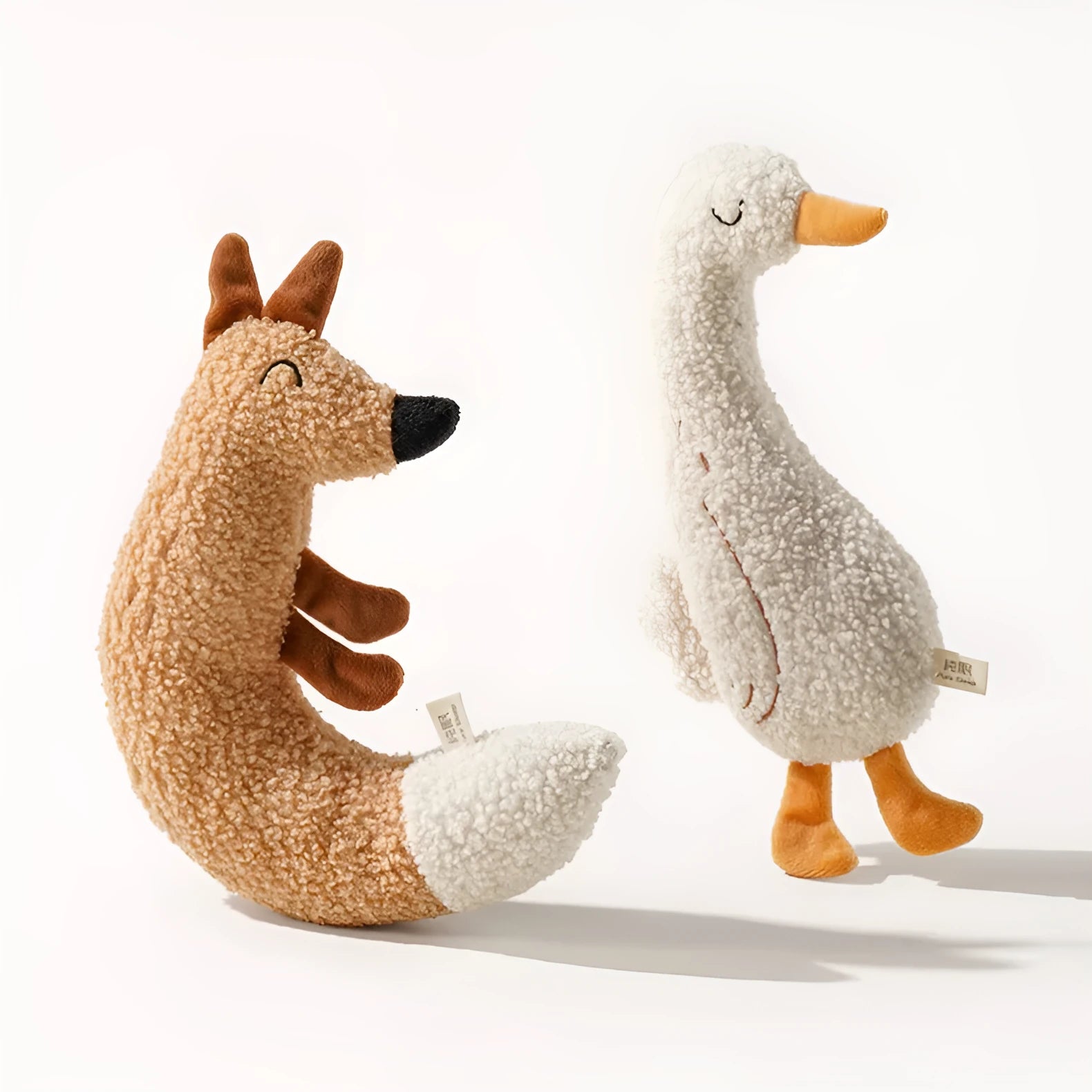 Cartoon fox and duckling pet chew toys made from teddy velvet fabric with sound paper components