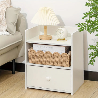 Woven paper storage basket in khaki colour, dimensions 35.5x16x10cm, on a desktop with remote controls and stationery