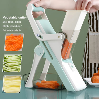 Orange multifunctional vegetable cutter kitchen tool with mandoline blades on a countertop.