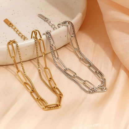Double layer geometric women's bracelet in gold or silver electroplated finish with linear design elements