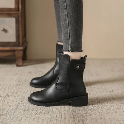 Black women's low heel boots with side zip and round toe design