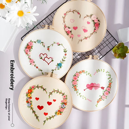 DIY Valentine's heart embroidery kit with cotton cloth and 20cm bamboo ring on a table.
