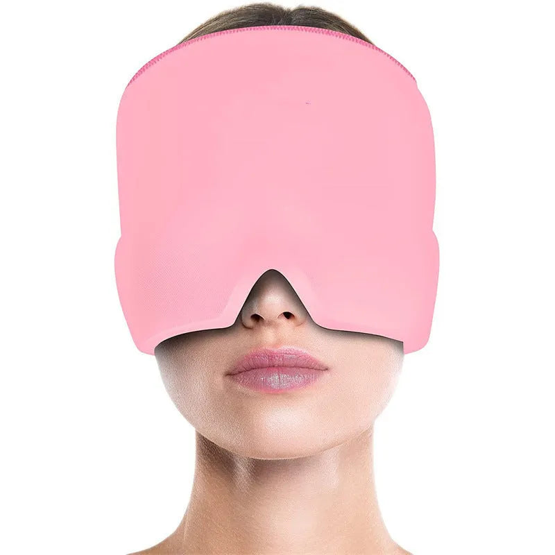 Black elastic cloth gel cold compress eye mask for headache relief on a grey background.