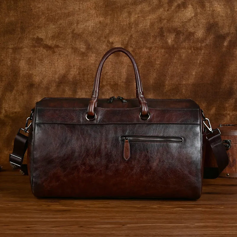 Handmade brown retro leather tote bag with large capacity for travel.