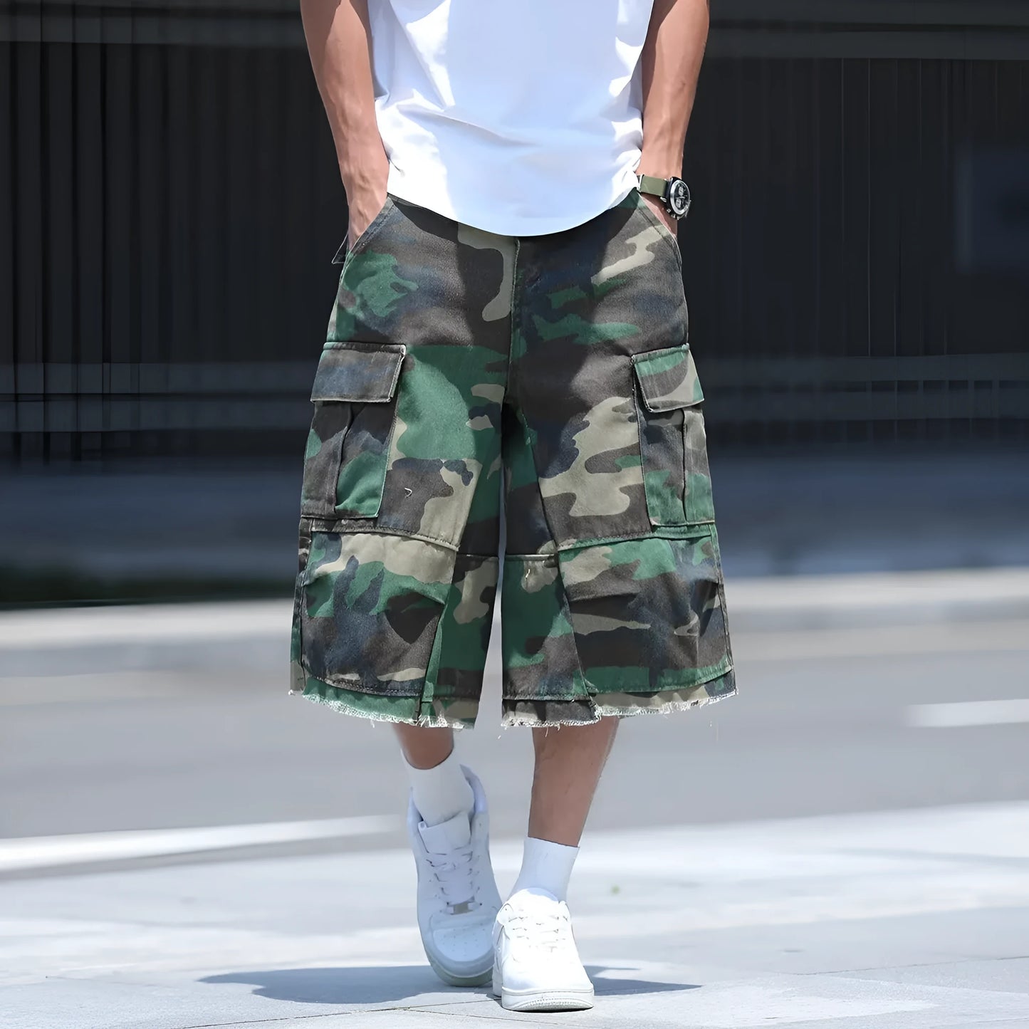 Man wearing loose-fit cropped camouflage shorts in a retro workwear style.
