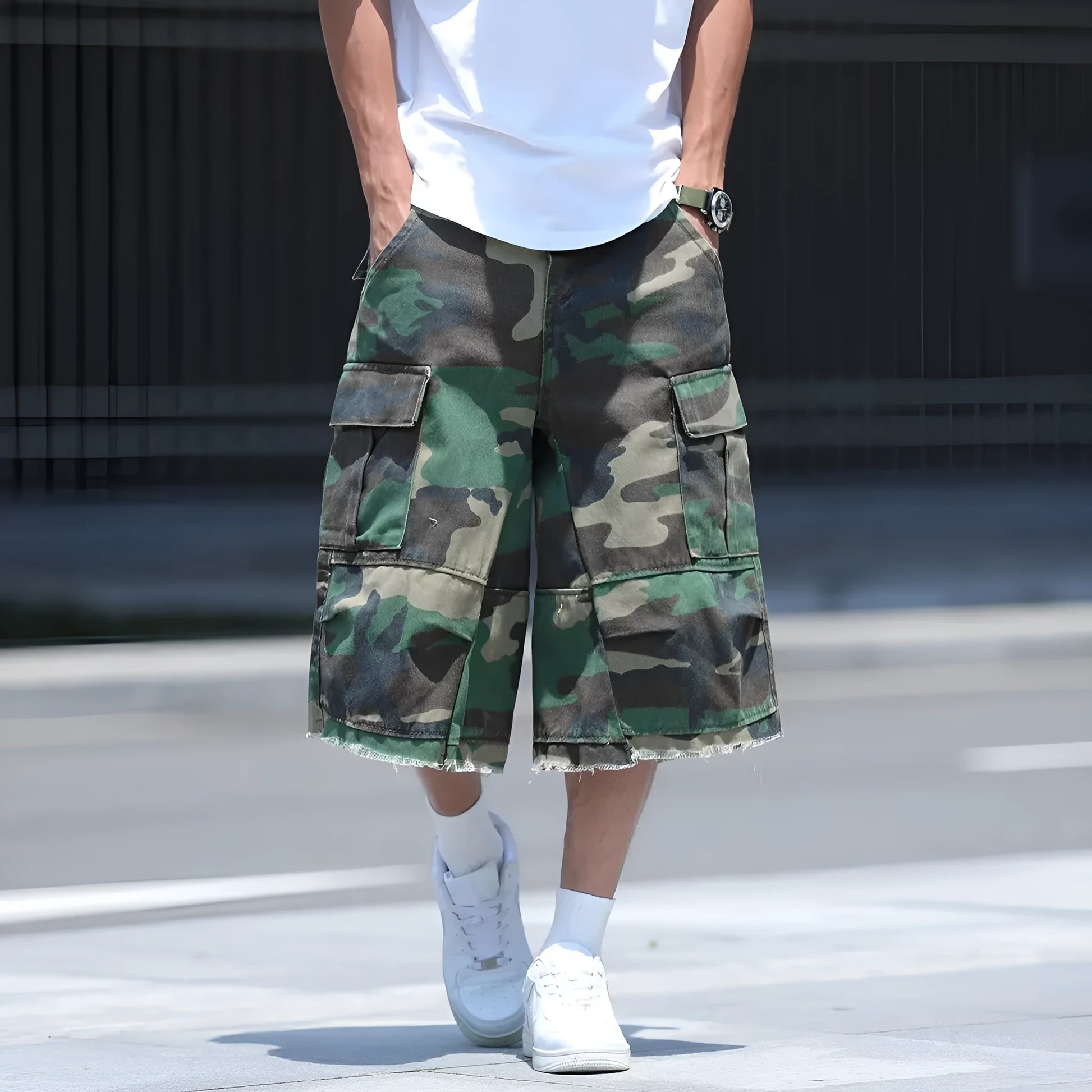 Man wearing loose-fit cropped camouflage shorts in a retro workwear style.
