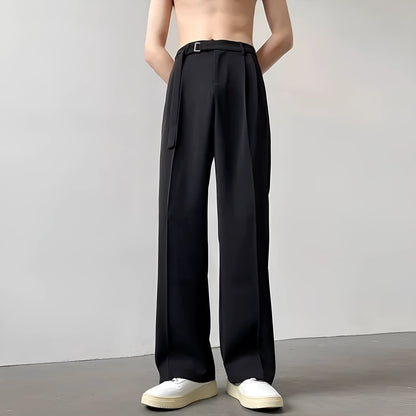 A pair of black straight leg wide fit women's trousers with a loose, casual silhouette on a hanger.