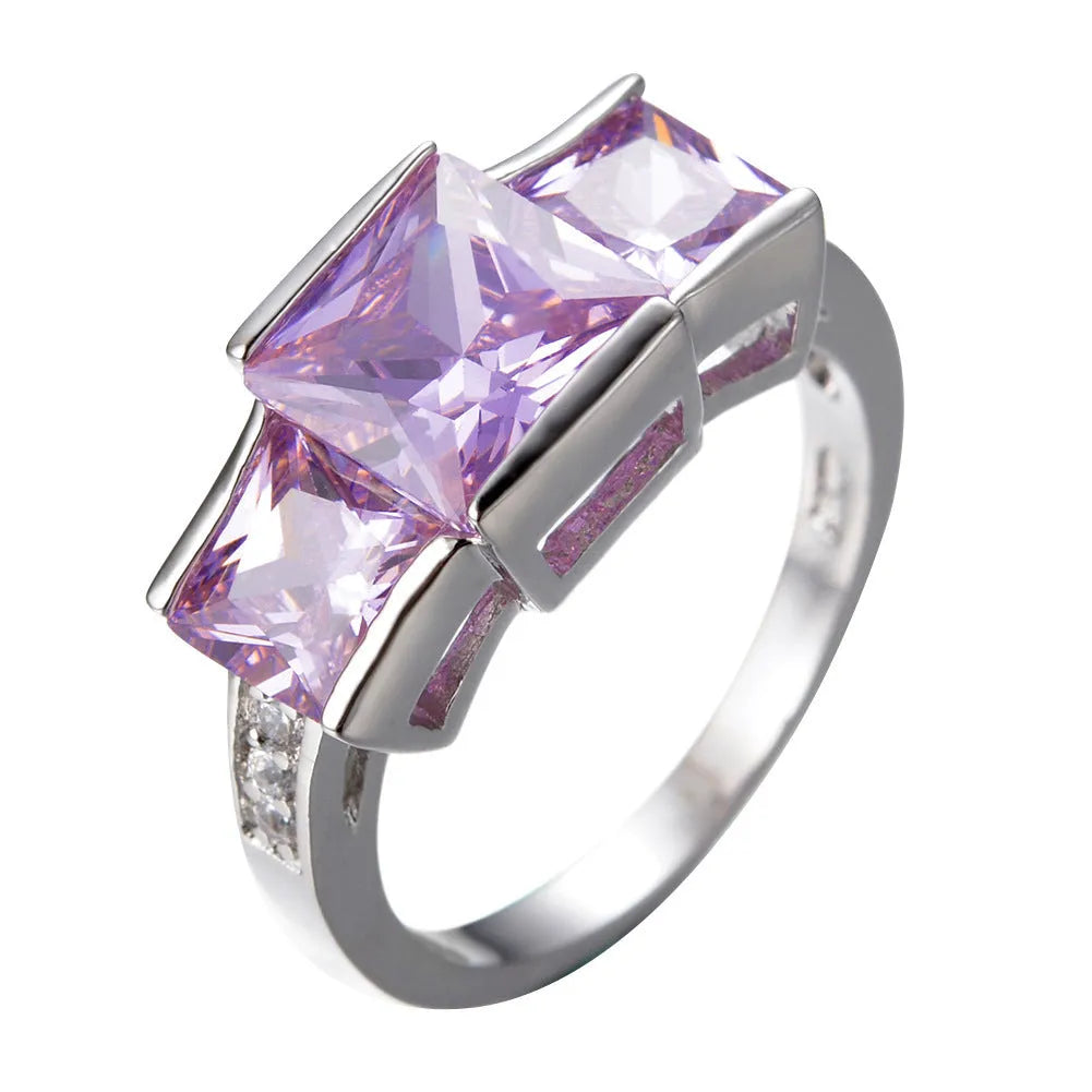 Aier Moxa geometric copper fashion ring in assorted electroplated colours on a plain background.