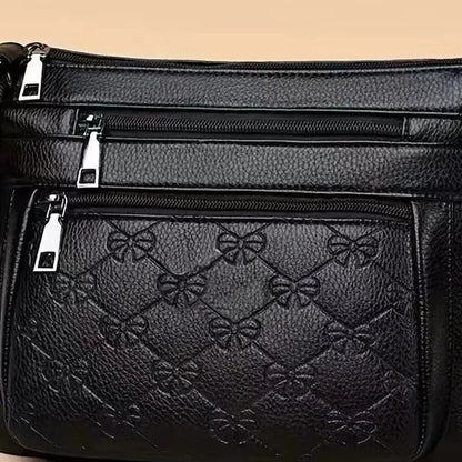 Butterfly black women's crossbody bag with horizontal square shape, slit pocket, and embossed PU detail