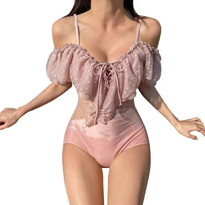 Pink solid-colour one-piece swimsuit for women on a mannequin.