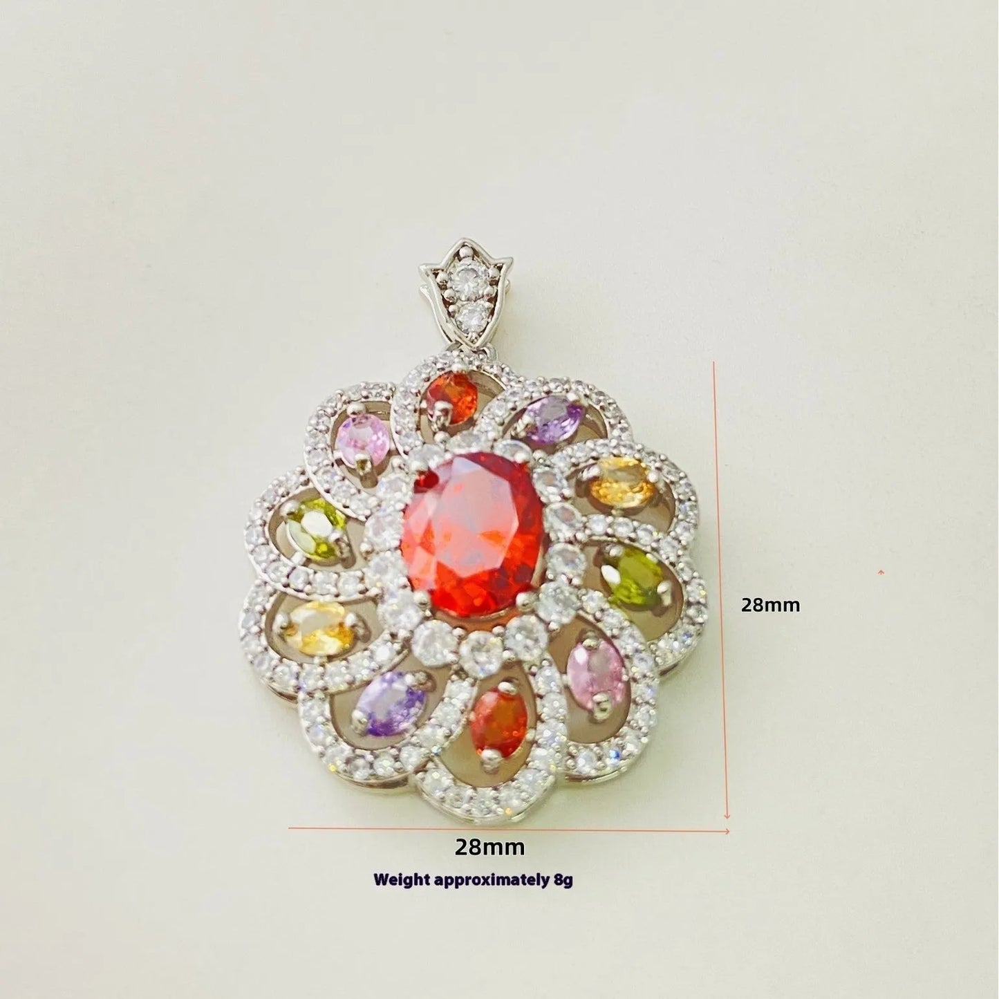 Close-up of a women's flower-shaped pendant necklace with a colourful zircon stone in a choice of gold, champagne gold, or platinum colour finishes.