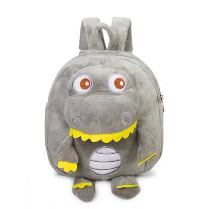 Soft blue plush children's backpack with an embroidered green dinosaur character and a soft handle.