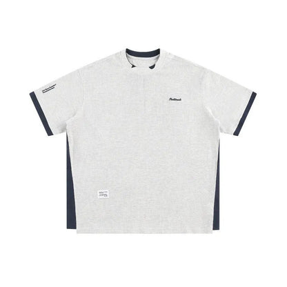 Loose fit waffle fabric T-shirt with retro alphabet embroidery on the chest, shown in navy blue.