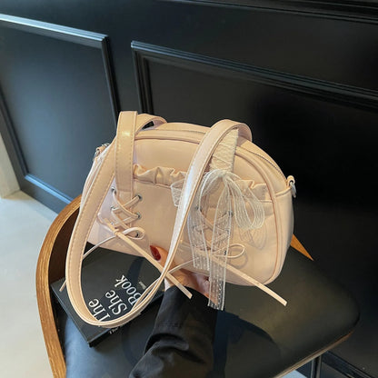 Women's PU leather casual shoulder handbag with a large bandage bow and sewing thread detail.