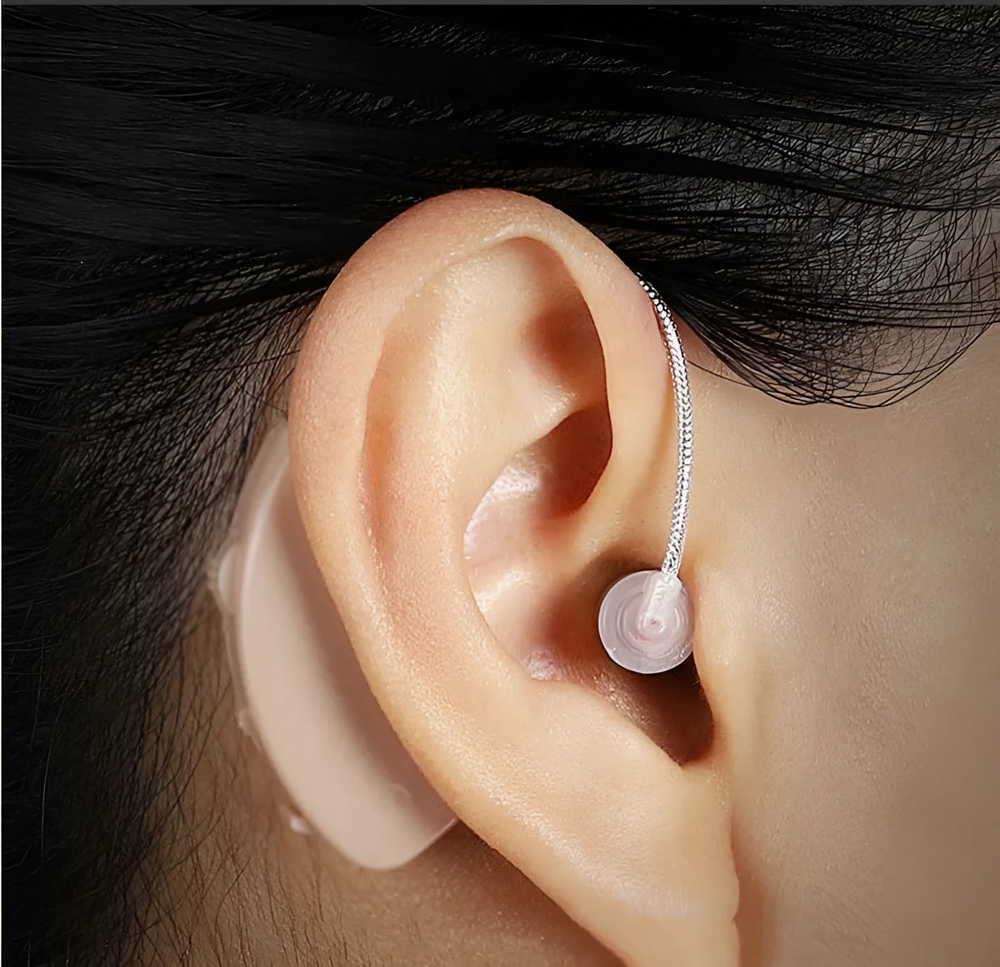 Black silicone rechargeable hearing aid amplifier for elderly users with charging cable