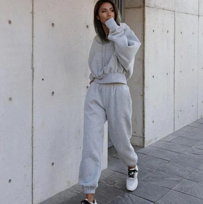 Women's polyester hoodie jacket and sports pants set in various colors for casual and athletic wear