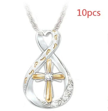Elegant two-tone cross pendant with sparkling accent, featuring a captivating geometric design and adjustable chain
