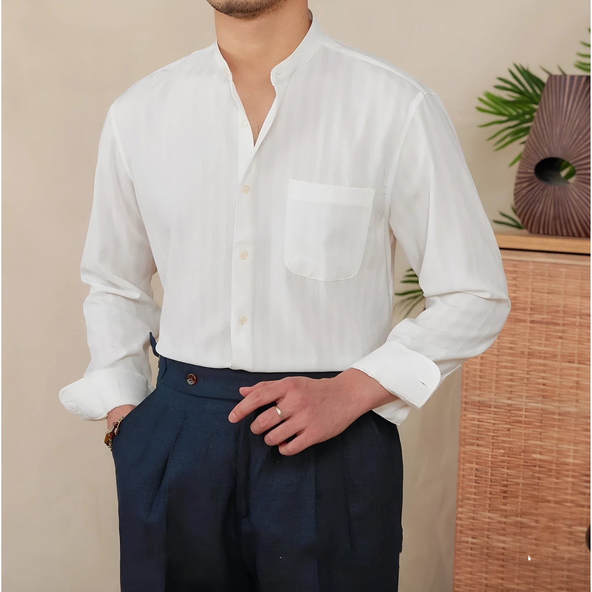Blue and white seersucker striped long sleeve shirt with a loose lapel baseball collar.