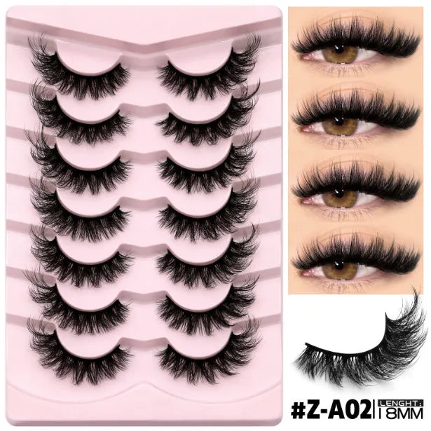 Box of natural false eyelashes in style A03 next to a tube of lash glue on a marble surface.