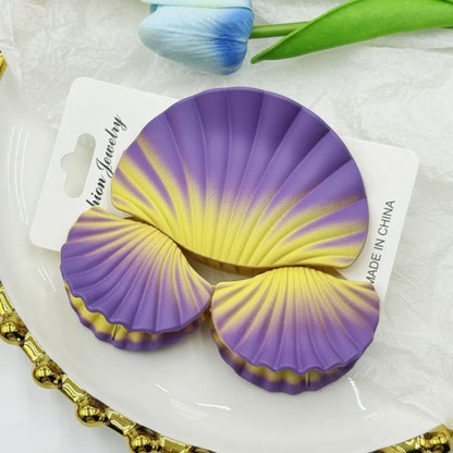 Gradient frosted plastic hair clip set in three pieces with shell decoration